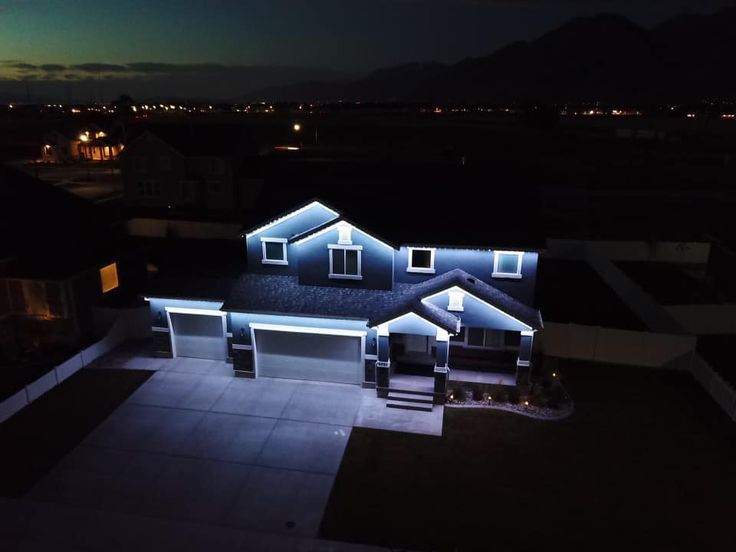 Permanent LED security lights illuminating the front entrance of a Calgary house